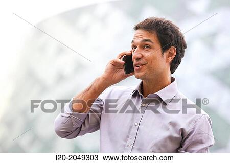Business man talking with smartphone in business center. San Sebastian Technology Park. Donostia. Gipuzkoa. Basque Country. Spain. View Large Photo Image Stock Image - Business man talking with smartphone in business center. San Sebastian Technology Park. Donostia. Gipuzkoa. Basque Country. Spain.. Fotosearch