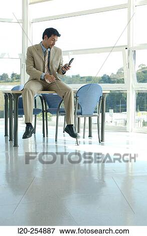 Business man with cell phone View Large Photo Image Stock Photo - Business man with cell phone. Fotosearch