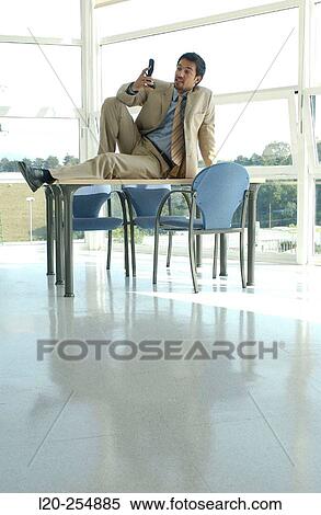 Business man with cell phone View Large Photo Image Stock Photography - Business man with cell phone. Fotosearch