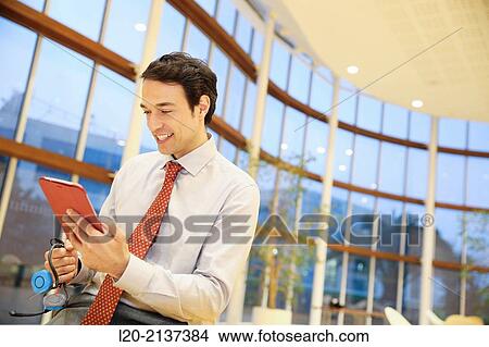 Business man with digital tablet View Large Photo Image Picture - Business man with digital tablet. Fotosearch