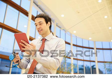 Business man with digital tablet View Large Photo Image Stock Image - Business man with digital tablet. Fotosearch