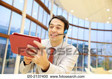 Business man with digital tablet View Large Photo Image Stock Image - Business man with digital tablet. Fotosearch