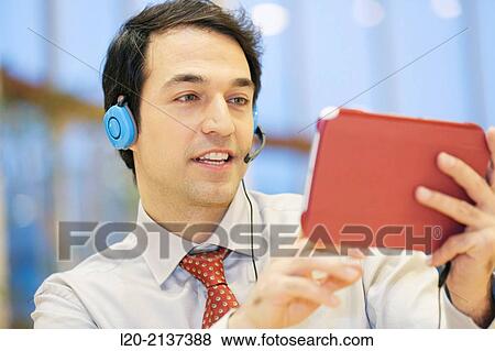 Business man with digital tablet View Large Photo Image Stock Photo - Business man with digital tablet. Fotosearch