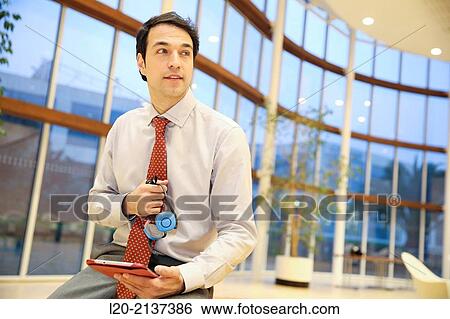 Business man with digital tablet View Large Photo Image Stock Photograph - Business man with digital tablet. Fotosearch