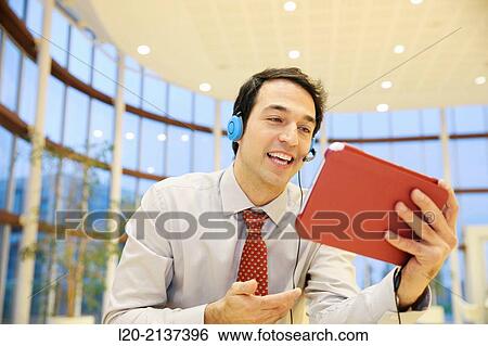 Stock Photograph - Business man with digital tablet. Fotosearch