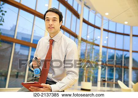 Business man with digital tablet View Large Photo Image Stock Photography - Business man with digital tablet. Fotosearch