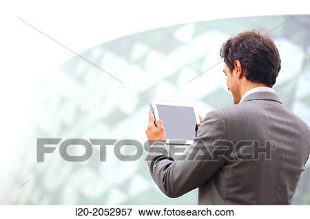 Business man with tablet in business center. San Sebastian Technology Park. Donostia. Gipuzkoa. Basque Country. Spain. View Large Photo Image Stock Photo - Business man with tablet in business center. San Sebastian Technology Park. Donostia. Gipuzkoa. Basque Country. Spain.. Fotosearch