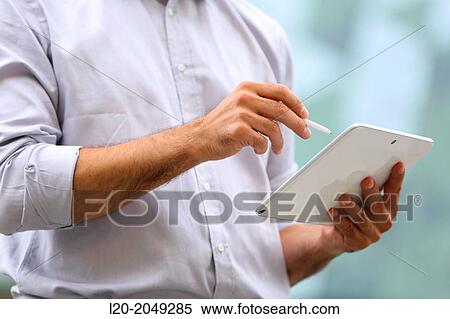 Business man with tablet in business center. San Sebastian Technology Park. Donostia. Gipuzkoa. Basque Country. Spain. View Large Photo Image Stock Photography - Business man with tablet in business center. San Sebastian Technology Park. Donostia. Gipuzkoa. Basque Country. Spain.. Fotosearch