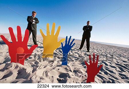 Picture - Business men contemplate hands. Fotosearch