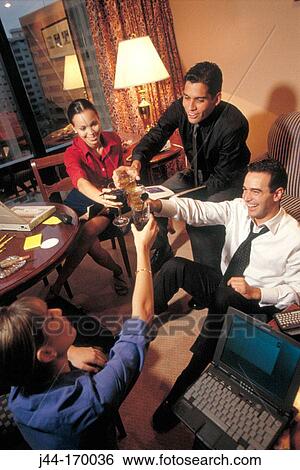 Business people celebrating in a hotel room View Large Photo Image Stock Photograph - Business people celebrating in a hotel room. Fotosearch