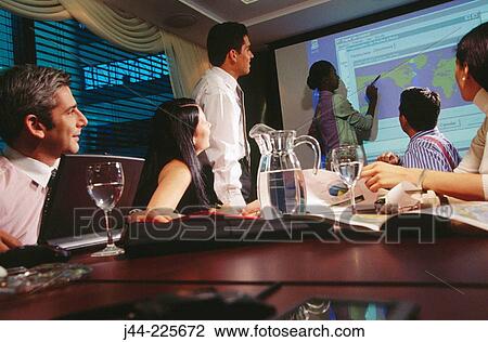 Business people in conference room during presentation View Large Photo Image Stock Image - Business people in conference room during presentation. Fotosearch