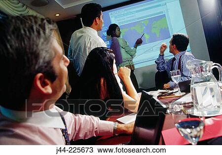 Business people in conference room during presentation View Large Photo Image Stock Image - Business people in conference room during presentation. Fotosearch