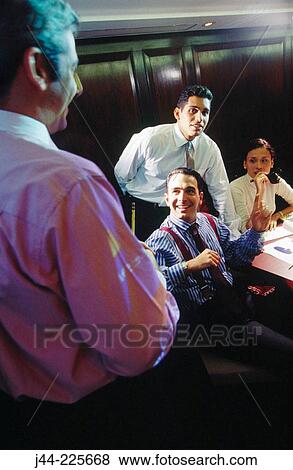 Stock Photo - Business people in conference room during presentation. Fotosearch
