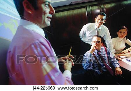 Business people in conference room during presentation View Large Photo Image Stock Photo - Business people in conference room during presentation. Fotosearch
