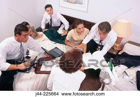 Business people working in a hotel room View Large Photo Image Picture - Business people working in a hotel room. Fotosearch