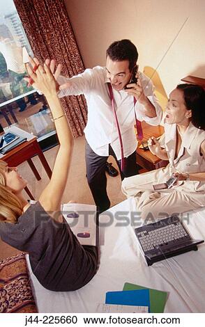 Business people working in a hotel room View Large Photo Image Stock Image - Business people working in a hotel room. Fotosearch