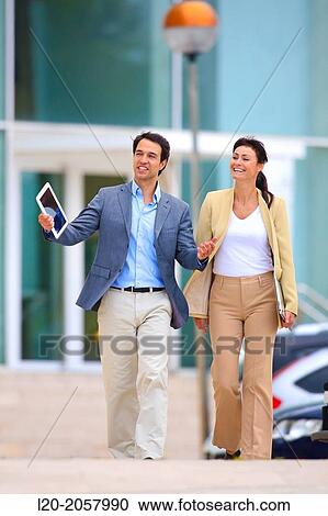 Business woman and businessman walking in business center. San Sebastian Technology Park. Donostia. Gipuzkoa. Basque Country. Spain. View Large Photo Image Stock Image - Business woman and businessman walking in business center. San Sebastian Technology Park. Donostia. Gipuzkoa. Basque Country. Spain.. Fotosearch