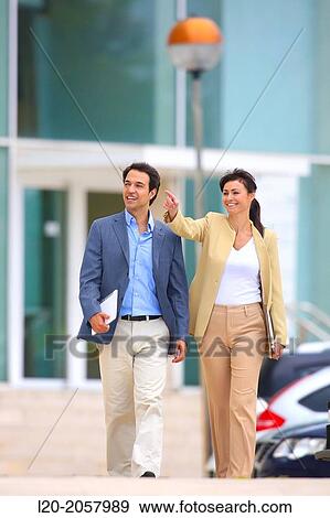 Business woman and businessman walking in business center. San Sebastian Technology Park. Donostia. Gipuzkoa. Basque Country. Spain. View Large Photo Image Stock Photo - Business woman and businessman walking in business center. San Sebastian Technology Park. Donostia. Gipuzkoa. Basque Country. Spain.. Fotosearch