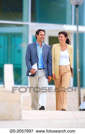 Business woman and businessman walking in business center. San Sebastian Technology Park. Donostia. Gipuzkoa. Basque Country. Spain. View Large Photo Image Stock Photo - Business woman and businessman walking in business center. San Sebastian Technology Park. Donostia. Gipuzkoa. Basque Country. Spain.. Fotosearch