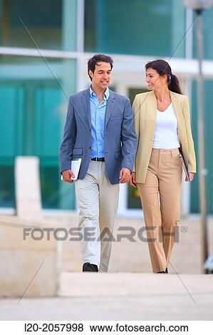 Business woman and businessman walking in business center. San Sebastian Technology Park. Donostia. Gipuzkoa. Basque Country. Spain. View Large Photo Image Stock Photo - Business woman and businessman walking in business center. San Sebastian Technology Park. Donostia. Gipuzkoa. Basque Country. Spain.. Fotosearch