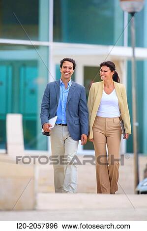 Business woman and businessman walking in business center. San Sebastian Technology Park. Donostia. Gipuzkoa. Basque Country. Spain. View Large Photo Image Stock Photograph - Business woman and businessman walking in business center. San Sebastian Technology Park. Donostia. Gipuzkoa. Basque Country. Spain.. Fotosearch