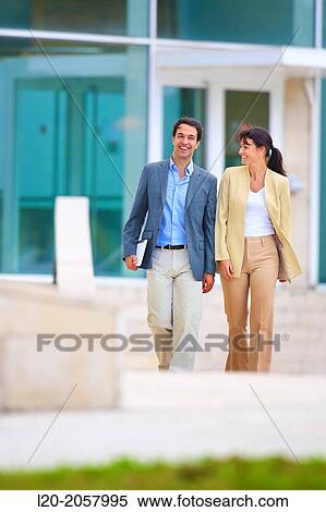 Business woman and businessman walking in business center. San Sebastian Technology Park. Donostia. Gipuzkoa. Basque Country. Spain. View Large Photo Image Stock Photography - Business woman and businessman walking in business center. San Sebastian Technology Park. Donostia. Gipuzkoa. Basque Country. Spain.. Fotosearch