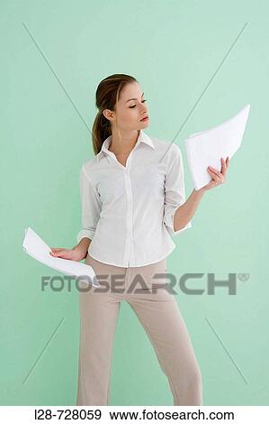 business woman checking documents View Large Photo Image Stock Photo - business woman checking documents. Fotosearch