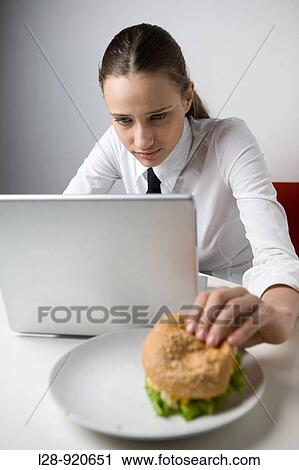 Business Woman Eating Sandwich and Working View Large Photo Image Stock Image - Business Woman Eating Sandwich and Working. Fotosearch