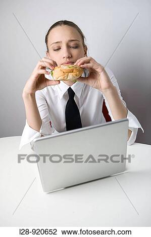 Business Woman Eating Sandwich and Working View Large Photo Image Stock Image - Business Woman Eating Sandwich and Working. Fotosearch