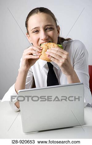 Business Woman Eating Sandwich and Working View Large Photo Image Stock Image - Business Woman Eating Sandwich and Working. Fotosearch