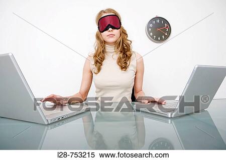 business woman eyes covered using two laptops View Large Photo Image Stock Photography - business woman eyes covered using two laptops. Fotosearch