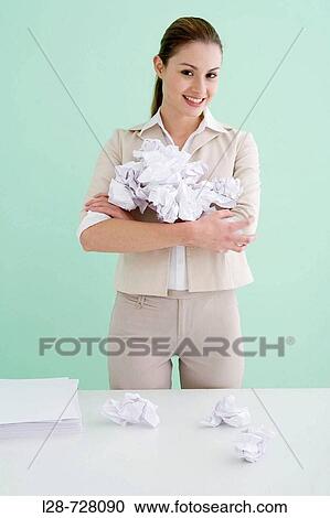 business woman holding Crumpled paper, smiling View Large Photo Image Stock Image - business woman holding Crumpled paper, smiling. Fotosearch