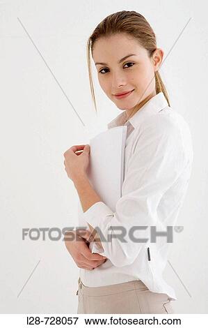 business woman holding paper, smiling View Large Photo Image Stock Photo - business woman holding paper, smiling. Fotosearch