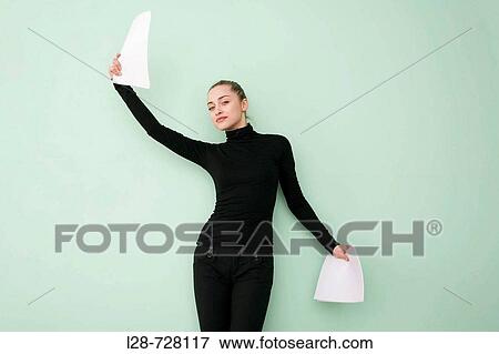 business woman holding paper, smiling View Large Photo Image Stock Photo - business woman holding paper, smiling. Fotosearch
