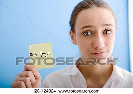 business woman holding sticky note View Large Photo Image Picture - business woman holding sticky note. Fotosearch