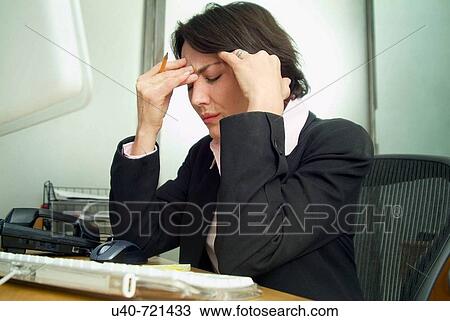 Stock Image - Business woman in office. Fotosearch