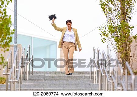 Picture - Business woman jumping stairs. San Sebastian Technology Park. Donostia. Gipuzkoa. Basque Country. Spain.. Fotosearch