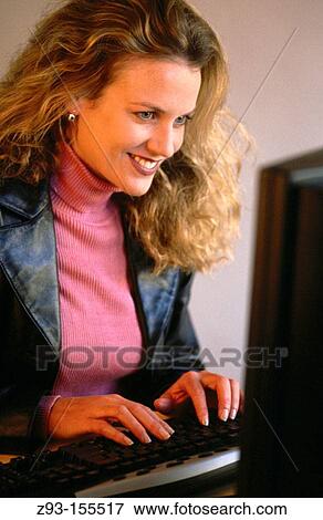 Stock Photo - Business woman on computer. Fotosearch