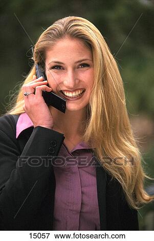 Business woman outdoors on cell phone View Large Photo Image Stock Photo - Business woman outdoors on cell phone. Fotosearch