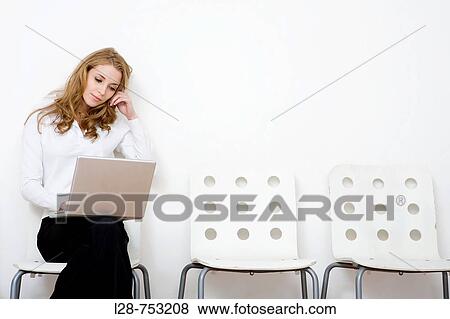 business woman sitting and using computer View Large Photo Image Stock Photo - business woman sitting and using computer. Fotosearch