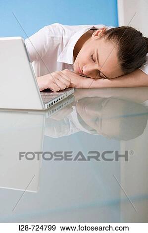 business woman sleeping in front of laptop View Large Photo Image Stock Photo - business woman sleeping in front of laptop. Fotosearch