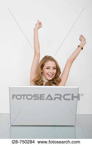 business woman smiling with her hands raised View Large Photo Image Picture - business woman smiling with her hands raised. Fotosearch