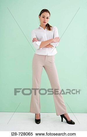 Business woman standing with arms crossed View Large Photo Image Stock Photography - Business woman standing with arms crossed. Fotosearch