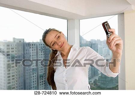business woman taking picture View Large Photo Image Stock Image - business woman taking picture. Fotosearch