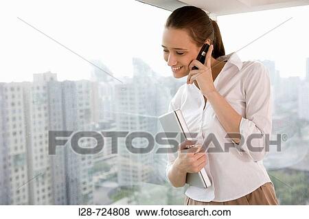 Business woman talking on phone View Large Photo Image Stock Photo - Business woman talking on phone. Fotosearch