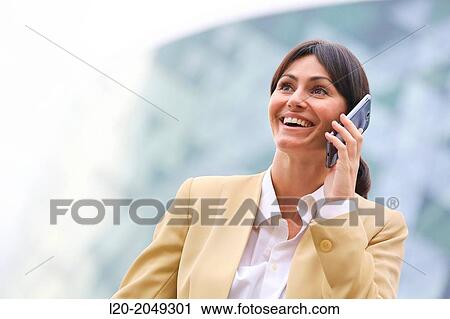 Business woman talking with smartphone business center. San Sebastian Technology Park. Donostia. Gipuzkoa. Basque Country. Spain. View Large Photo Image Stock Image - Business woman talking with smartphone business center. San Sebastian Technology Park. Donostia. Gipuzkoa. Basque Country. Spain.. Fotosearch