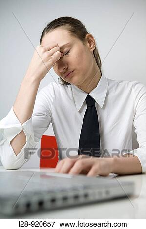 Stock Photo - Business Woman Tired at laptop. Fotosearch