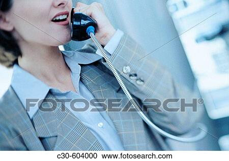 Business woman uses pay phone View Large Photo Image Stock Image - Business woman uses pay phone. Fotosearch