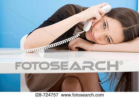 business woman using a phone View Large Photo Image Stock Photo - business woman using a phone. Fotosearch
