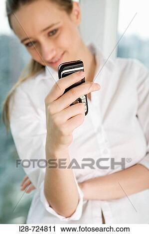 business woman using cell phone View Large Photo Image Stock Image - business woman using cell phone. Fotosearch